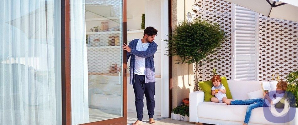 Father at sliding glass door